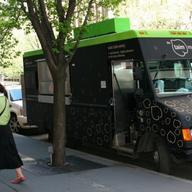 This passerby seemed to be color-coordinated with the Taino food truck, parked on Hudson Street. 